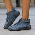 Ankle-height lace-up sneakers with stitched panels, ankle straps and contrast soles