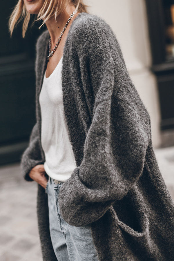 Women's oversized open front knit midi cardigan with long sleeves and front pockets