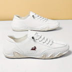 Low-profile lace-up trainers with rounded toes, stitched panels and textured soles