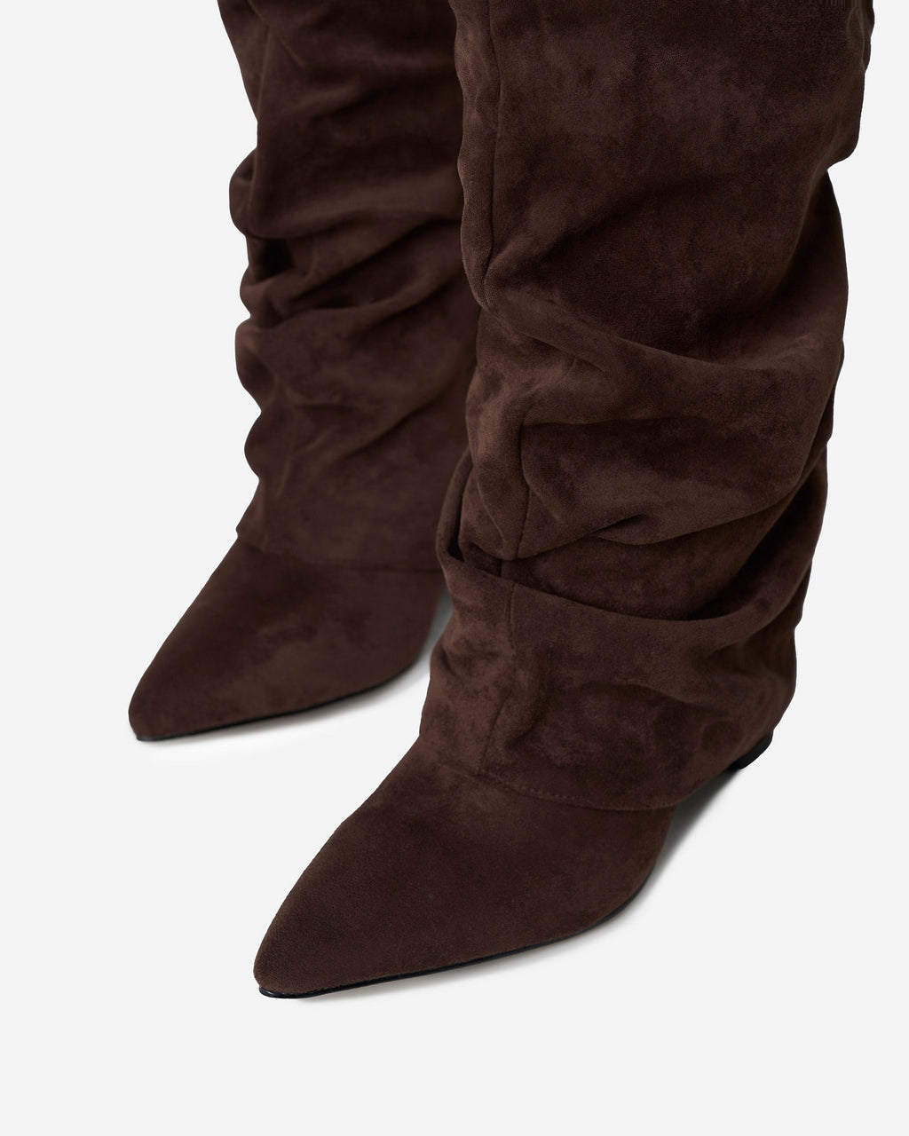 Women's brown slouchy knee-high boots with pointed toes
