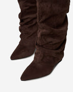 Women's brown slouchy knee-high boots with pointed toes