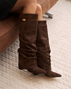Women's brown slouchy knee-high boots with pointed toes