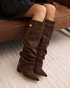 Women's brown slouchy knee-high boots with pointed toes