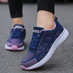 Women's low top lace-up sneakers with textured upper