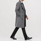 Men's long double-breasted trench coat with wide lapels and buttoned cuffs