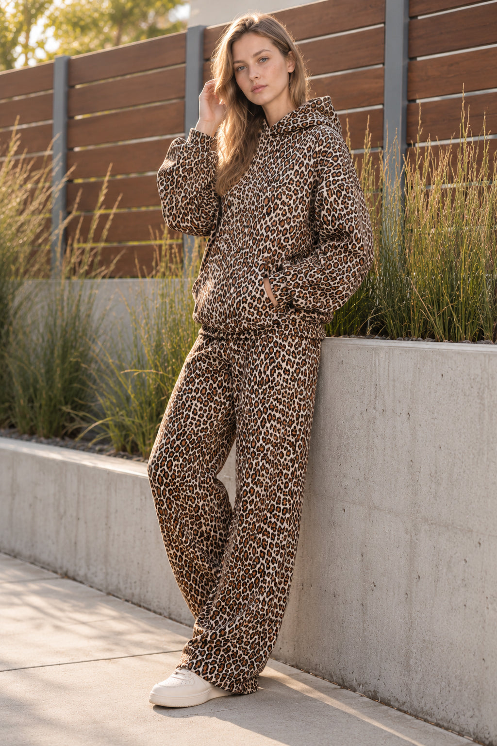 Women's leopard print hooded sweatshirt and matching full-length trousers set