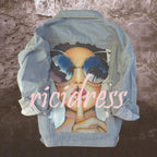 Women's printed denim jacket with portrait graphic and distressed details