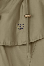 Women's hooded long raincoat with cape overlay and button front