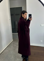 Women's burgundy double-breasted trench coat with belt and long sleeves
