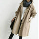 Women's hooded trench coat with button front and angled pockets