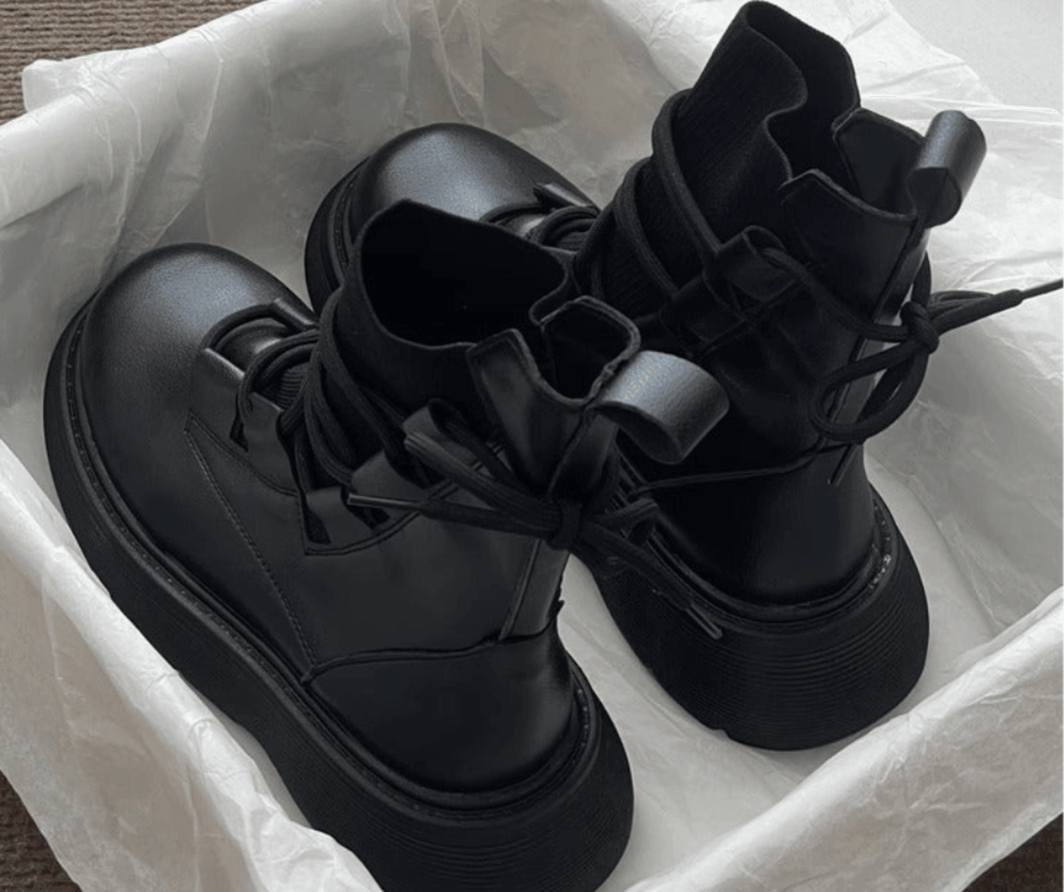 Women's lace-up ankle boots with round toes and treaded soles