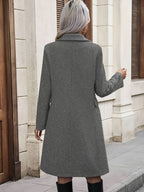 Women's double-breasted mid-length trench coat with notched collar and flap pockets