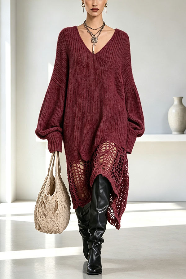 Women's ribbed knit V-neck dress with long sleeves and asymmetrical openwork hem