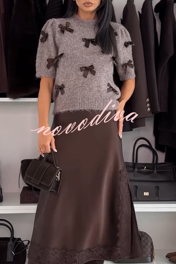 Women's brown knit crop top with dark bow details and short sleeves
