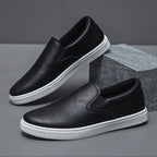 Men's slip-on loafers with rounded toes and contrasting white soles