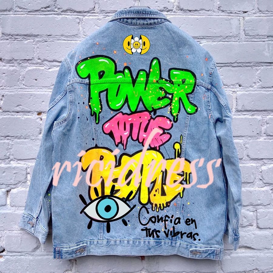 Graphic denim jacket with colourful Halloween-style artwork on the back