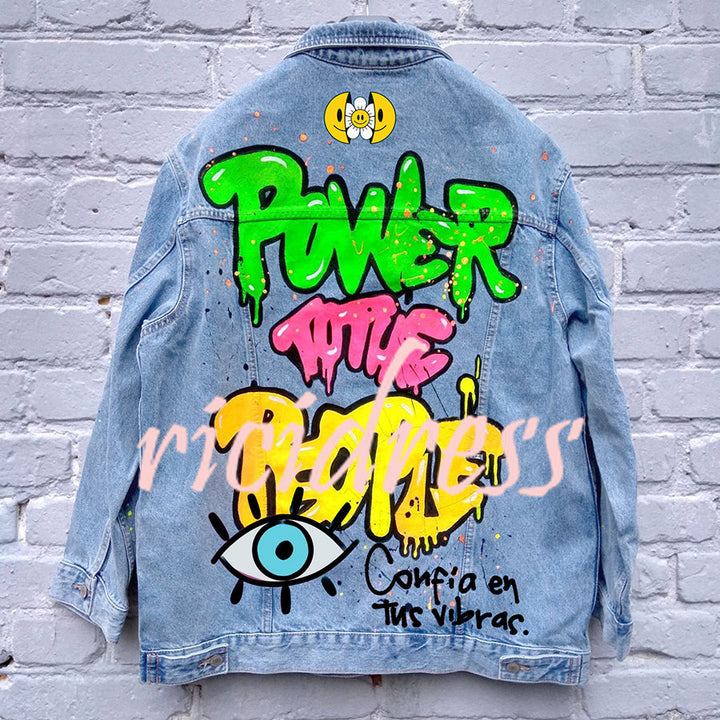 Graphic denim jacket with colourful Halloween-style artwork on the back