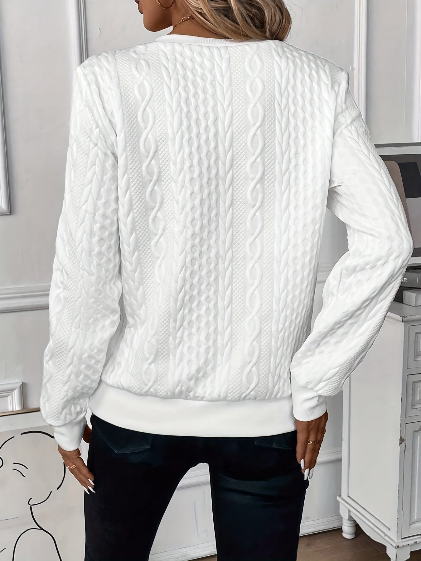 Women's textured cable knit sweater with round neckline and quarter-zip fastening