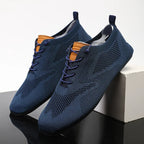 Knit sneakers with lace-up fronts, round toes and pull tabs