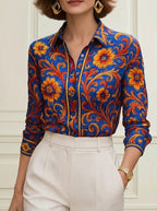 Women's blue floral button blouse with pointed collar and long sleeves