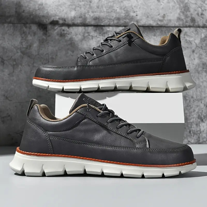 Low top lace-up sneaker with stitched panels and chunky textured sole