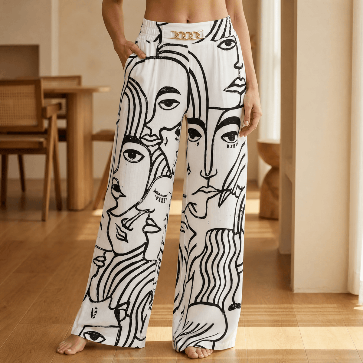 Women's high-waisted wide leg trousers with front chain detail and side pockets