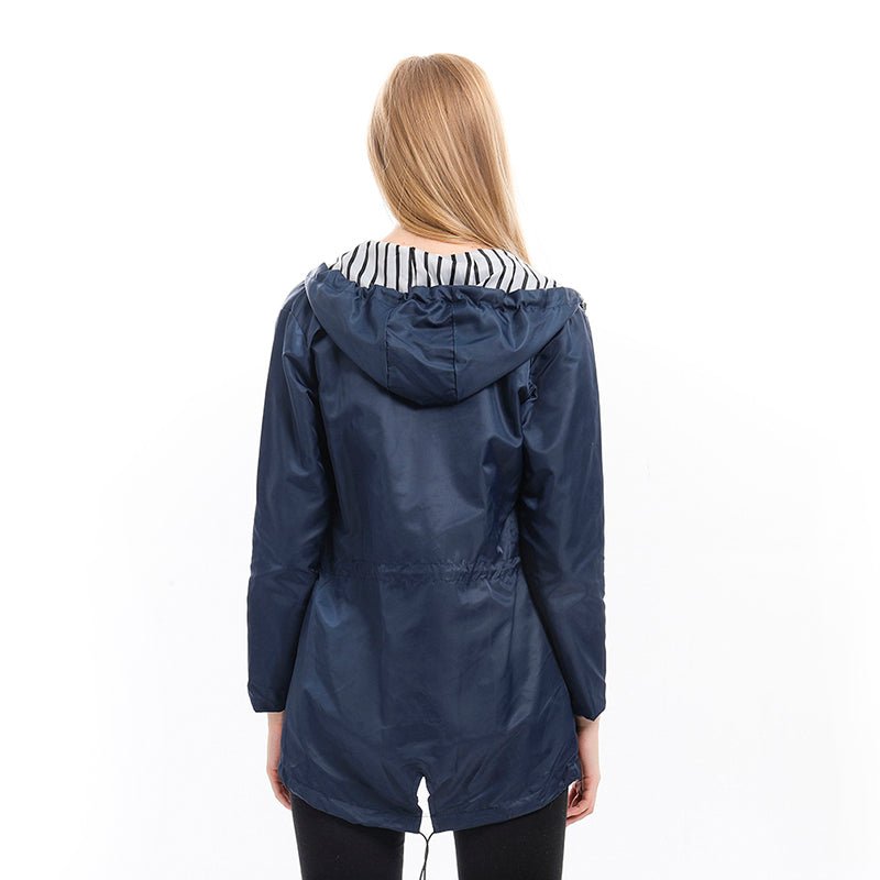 Women's hooded longline rain coat with striped lining and zipped pockets