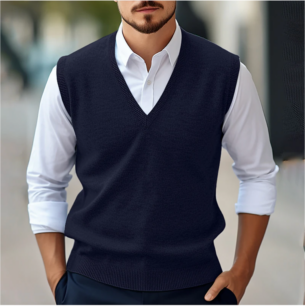 Men's sleeveless V-neck sweater vest layered over a white shirt