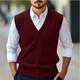 Men's sleeveless V-neck sweater vest layered over a white shirt