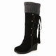 Women's knee-high wedge boots with fur-look trim, buckles and tassel details
