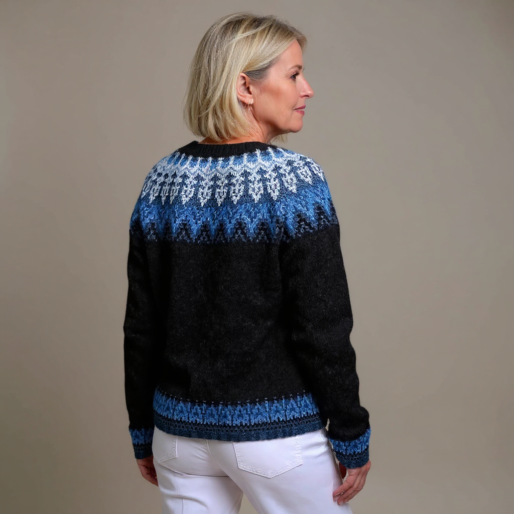 Women's black cardigan with blue and white Nordic pattern and brown buttons