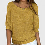 Women's textured knit pullover with round neckline and three-quarter sleeves