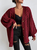 Women's oversized cable knit cardigan with V-neck, buttons and long sleeves