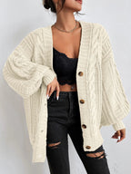 Women's oversized cable knit cardigan with V-neck, buttons and long sleeves