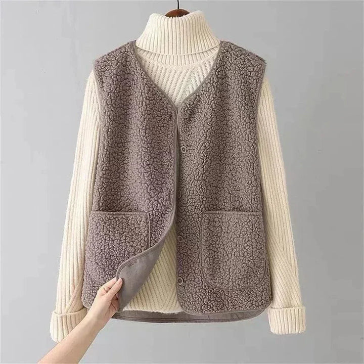 Women's sleeveless textured vest with V-neck, buttons and patch pockets