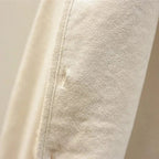 Women's sleeveless textured vest with V-neck, buttons and patch pockets