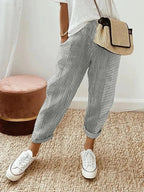 Women's cropped striped trousers with elastic waist and cuffed hems