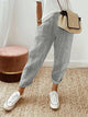 Women's cropped striped trousers with elastic waist and cuffed hems