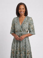 Women's green floral maxi dress with V-neck and short sleeves