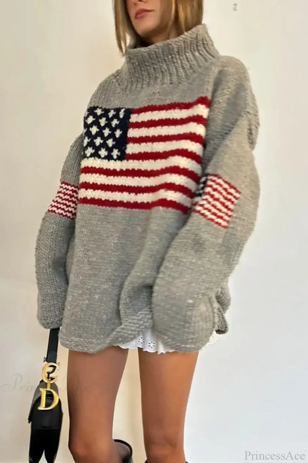 Women's knit sweater with high neck and stars and stripes flag motif
