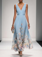 Women's floral V-neck maxi dress with sleeveless bodice and flared skirt