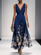 Women's floral V-neck maxi dress with sleeveless bodice and flared skirt