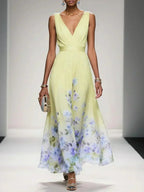 Women's floral V-neck maxi dress with sleeveless bodice and flared skirt