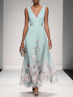 Women's floral V-neck maxi dress with sleeveless bodice and flared skirt