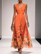 Women's floral V-neck maxi dress with sleeveless bodice and flared skirt