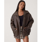 Women's oversized faux leather jacket with wide collar and zip front