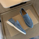 Round-toe men's slip-on loafers with light-coloured soles