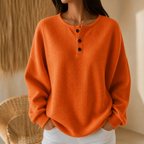 Women's waffle knit henley top with long sleeves and button placket
