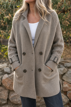 Women's longline double-breasted coat with knitted sleeves and buckle cuffs