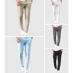 Men's beige relaxed-fit trousers with drawstring waist and flat front, full-length view.